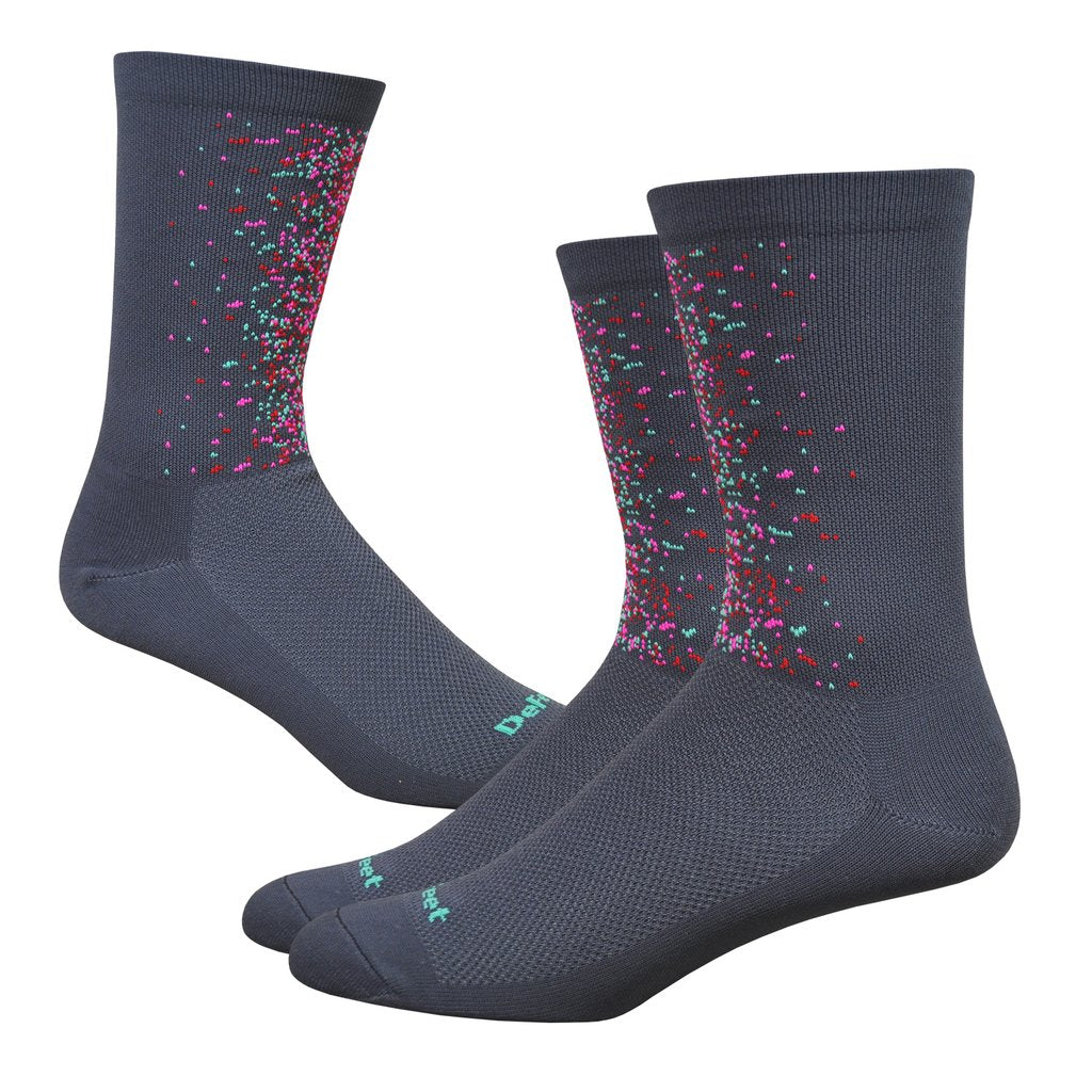 dark grey cycling sock with colored splatter on the front of the cuff, shown from both sides